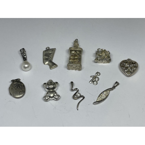 597 - TEN VARIOUS SILVER CHARMS