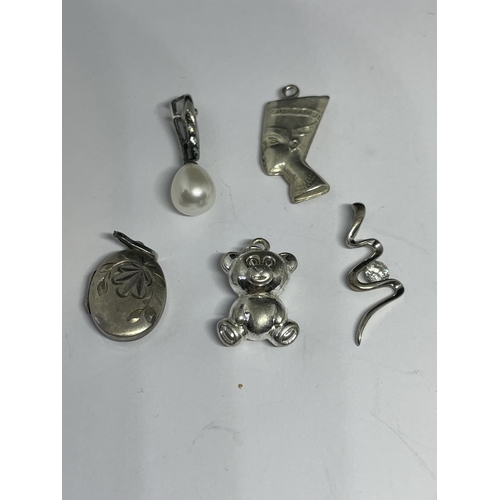 597 - TEN VARIOUS SILVER CHARMS