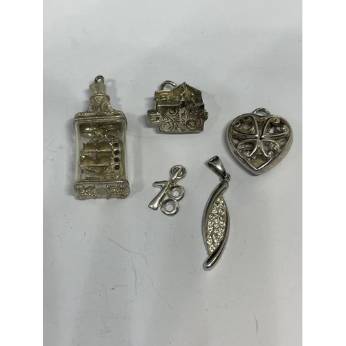 597 - TEN VARIOUS SILVER CHARMS