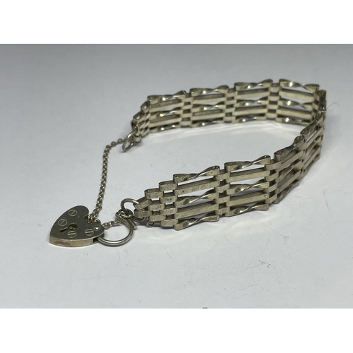 602 - A MARKED SILVER FIVE BAR GATE BRACELET