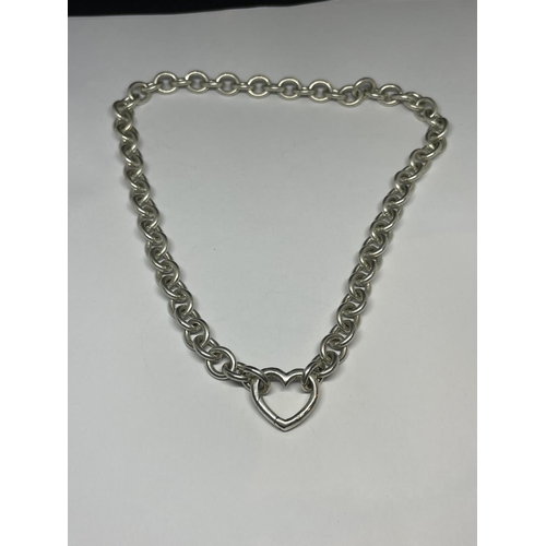 620 - A HEAVY SILVER NECKLACE WITH A HEART LINK