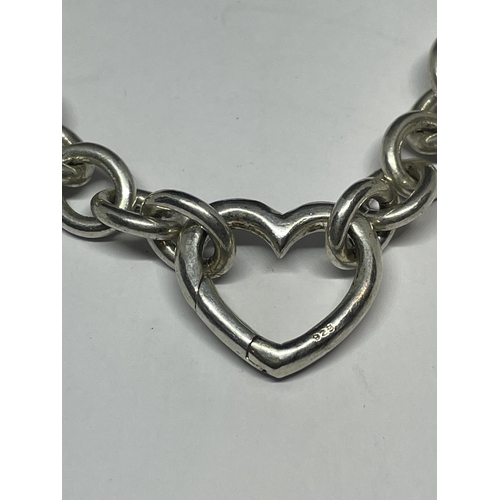 620 - A HEAVY SILVER NECKLACE WITH A HEART LINK