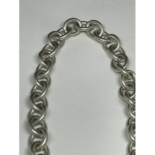 620 - A HEAVY SILVER NECKLACE WITH A HEART LINK