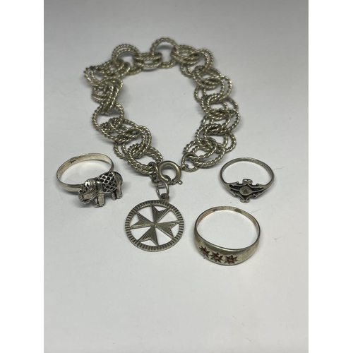 622 - A SILVER BRACELET AND THREE SILVER RINGS