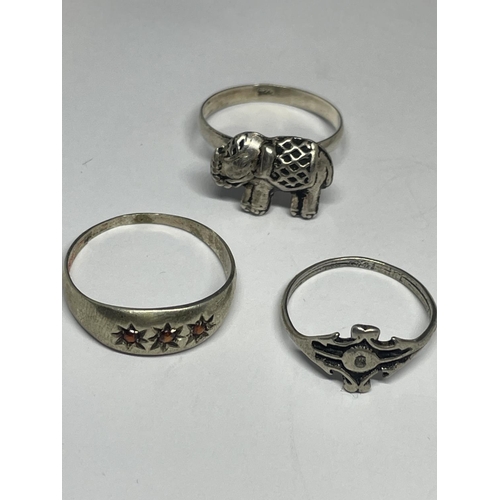 622 - A SILVER BRACELET AND THREE SILVER RINGS