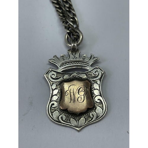 678 - A SILVER CHAIN WITH FOB PENDANT