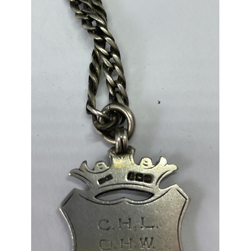 678 - A SILVER CHAIN WITH FOB PENDANT