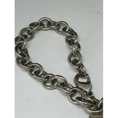 698 - A SILVER BRACELET WITH A FOB