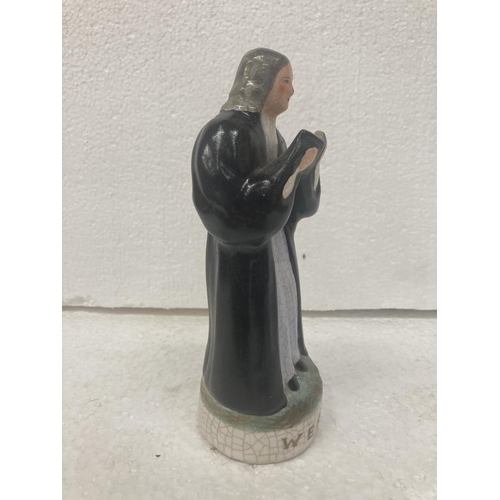 711 - A STAFFORDSHIRE POTTERY FIGURE OF JOHN WESLEY- 17.5 CM