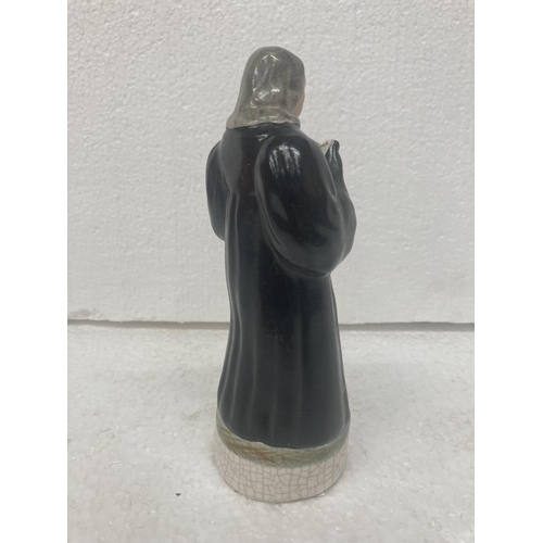 711 - A STAFFORDSHIRE POTTERY FIGURE OF JOHN WESLEY- 17.5 CM