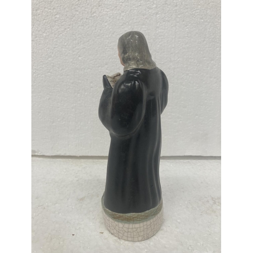 711 - A STAFFORDSHIRE POTTERY FIGURE OF JOHN WESLEY- 17.5 CM