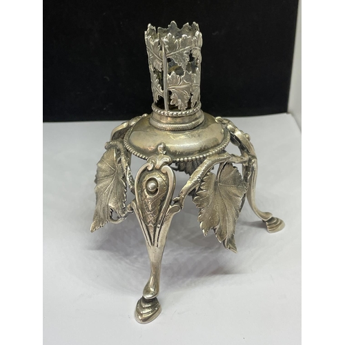 790 - AN ORNATE WHITE METAL CANDLE HOLDER