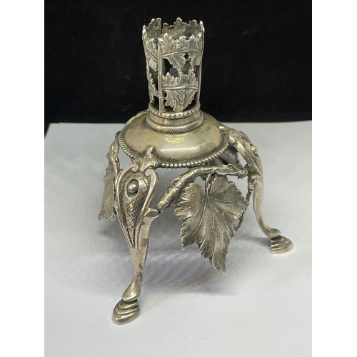 790 - AN ORNATE WHITE METAL CANDLE HOLDER