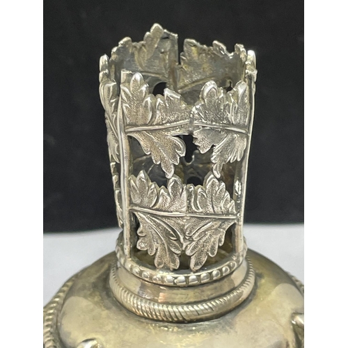 790 - AN ORNATE WHITE METAL CANDLE HOLDER