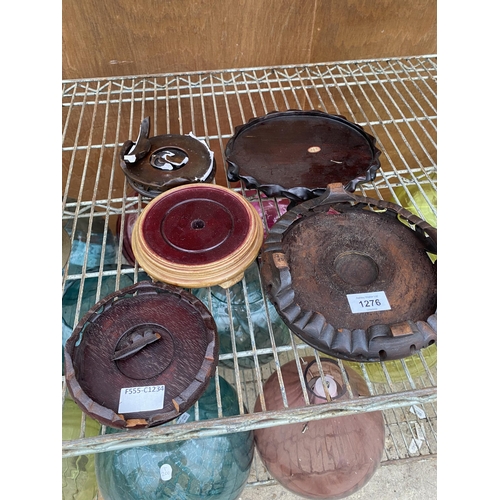 1276 - AN ASSORTMENT OF TREEN TRIVET STANDS AND BOTTLE COASTERS ETC