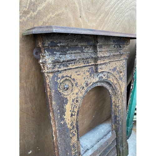 1281 - A DECORATIVE CAST IRON FIRE PLACE