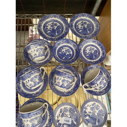 1428 - AN ASSORTMENT OF BLUE AND WHITE CERAMIC WARE TO INCLUDE CUPS AND PLATES ETC