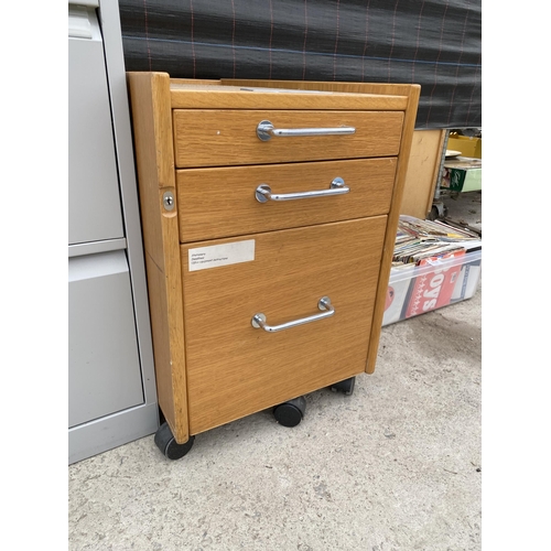 1715 - A WOODEN THREE DRAWER CABINET AND A FOUR DRAWER METAL FILING CABINET