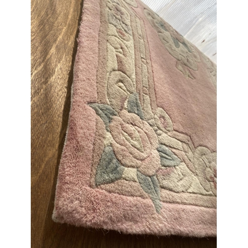 2195 - A SMALL PINK PATTERNED RUG