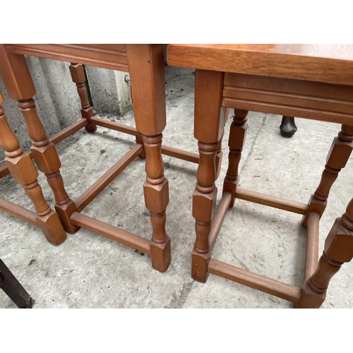 2228 - A NEST OF THREE OAK TABLES