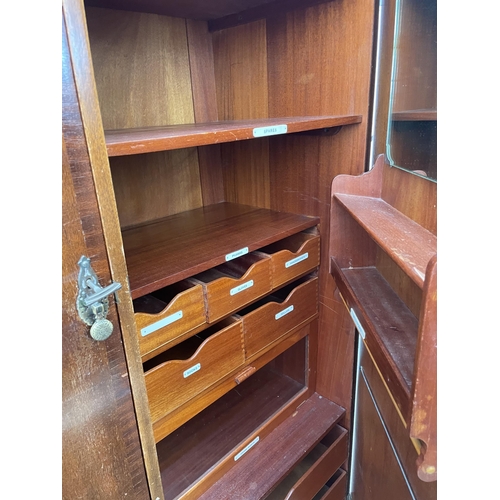 2256 - A MAHOGANY TWO DOOR COMPACTUM WARDROBE