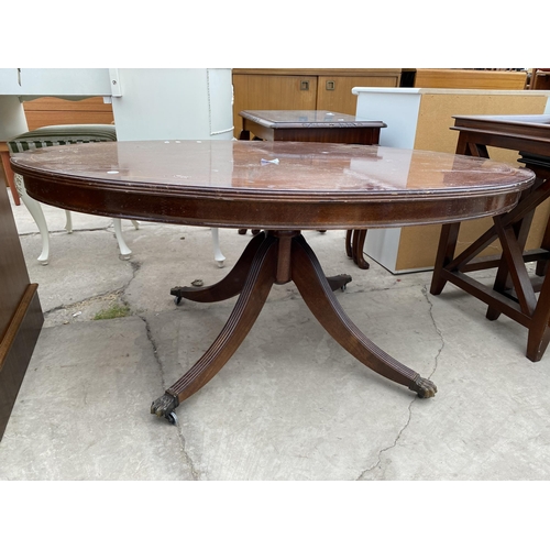 2353 - AN OVAL MAHOGANY AND CROSSBANDED COFFEE TABLE