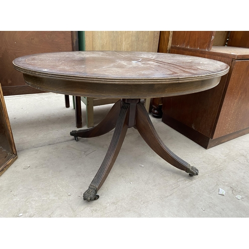 2357 - AN OVAL MAHOGANY AND CROSSBANDED COFFEE TABLE