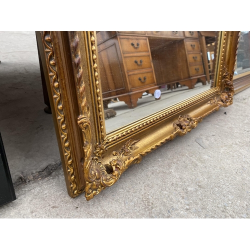 2410 - A MODERN GILT FRAMED WALL MIRROR, 36X26