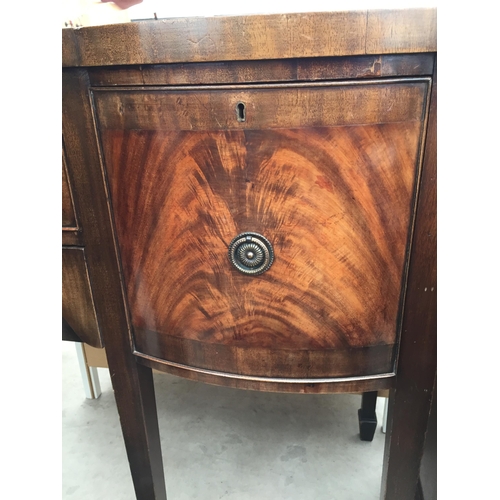 2456 - A REGENCY STYLE BOW FRONTED MAHOGANY AND CROSS BANDED SIDEBOARD ON TAPERED LEGS WITH SPADE FEET, 59.... 