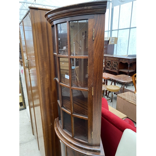 2473 - A MAHOGANY BOW FRONT CORNER CABINET