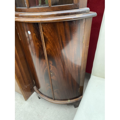 2473 - A MAHOGANY BOW FRONT CORNER CABINET