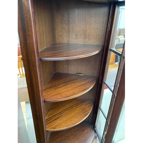 2473 - A MAHOGANY BOW FRONT CORNER CABINET