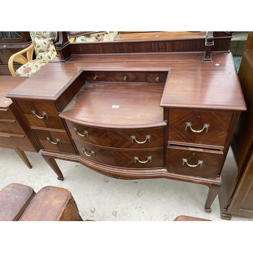 2502 - AN EDWARDIAN MAHOGANY BOW FRONTED DRESSING TABLE ENCLOSING FOUR SHORT, TWO LONG AND THREE JEWELLED D... 