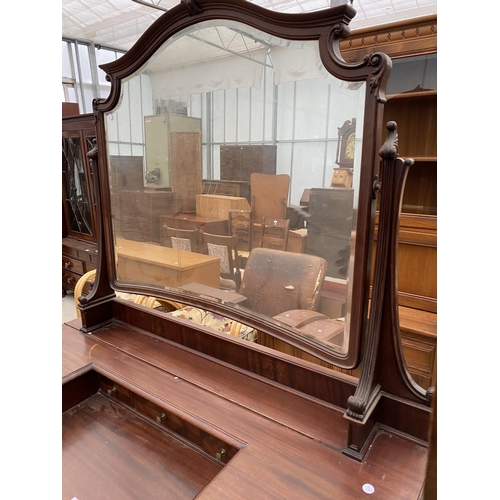 2502 - AN EDWARDIAN MAHOGANY BOW FRONTED DRESSING TABLE ENCLOSING FOUR SHORT, TWO LONG AND THREE JEWELLED D... 