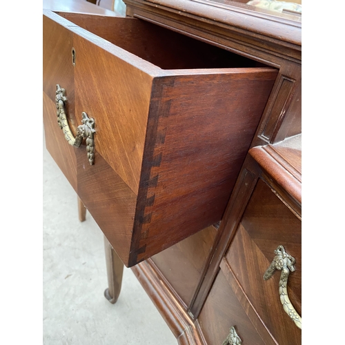 2502 - AN EDWARDIAN MAHOGANY BOW FRONTED DRESSING TABLE ENCLOSING FOUR SHORT, TWO LONG AND THREE JEWELLED D... 