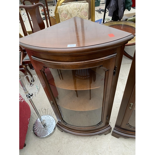 2519 - A PAIR OF MODERN MAHOGANY BOW FRONTED CORNER CABINETS ON BRACKET FEET, 24