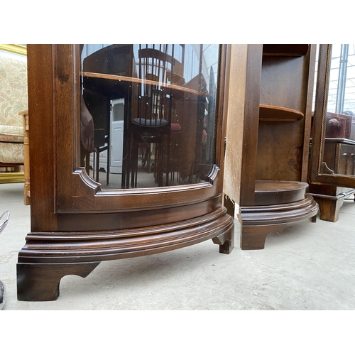 2519 - A PAIR OF MODERN MAHOGANY BOW FRONTED CORNER CABINETS ON BRACKET FEET, 24