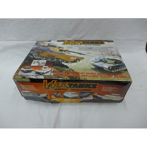 2869 - A BOXED ENTERTECH LASER TANKS BATTLE CHALLENGE WITH TWO TANKS AND RADIO REMOTE CONTROLS