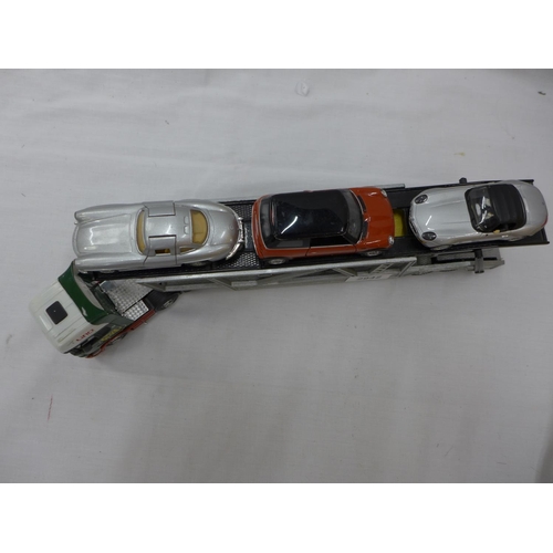 2942 - A MODEL CAR TRANSPORTER WITH FIVE ASSORTED CARS ON BOARD TO INCLUDE A MERCEDES 300SL