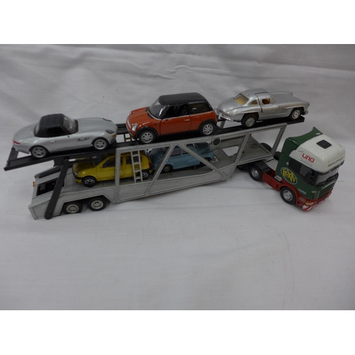 2942 - A MODEL CAR TRANSPORTER WITH FIVE ASSORTED CARS ON BOARD TO INCLUDE A MERCEDES 300SL