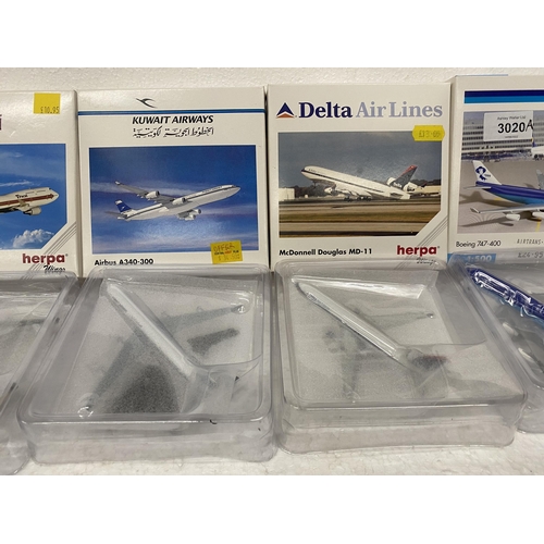 3020A - FOUR HERPA WINGS COLLECTION PLANES TO INCLUDE AN AIRBUS, TWO BOEING 747s AND A McDONNELL DOUGLAS MD-... 