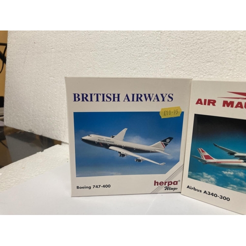 3031 - A COLLECTION OF FOUR COLLECTOR'S AEROPLANES TO INCLUDE EAST MIDLANES AIRPORT BOEING 777-300 NO. 5064... 