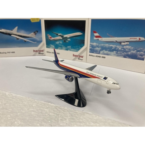 3031 - A COLLECTION OF FOUR COLLECTOR'S AEROPLANES TO INCLUDE EAST MIDLANES AIRPORT BOEING 777-300 NO. 5064... 