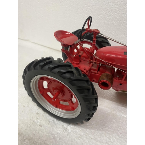 3057 - A FRANKLIN MINT 1:12 SCALE DIECAST MODEL OF A FARMALL TRACTOR