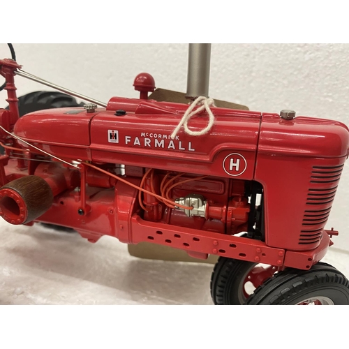 3057 - A FRANKLIN MINT 1:12 SCALE DIECAST MODEL OF A FARMALL TRACTOR