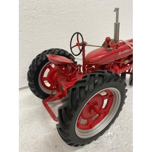 3057 - A FRANKLIN MINT 1:12 SCALE DIECAST MODEL OF A FARMALL TRACTOR