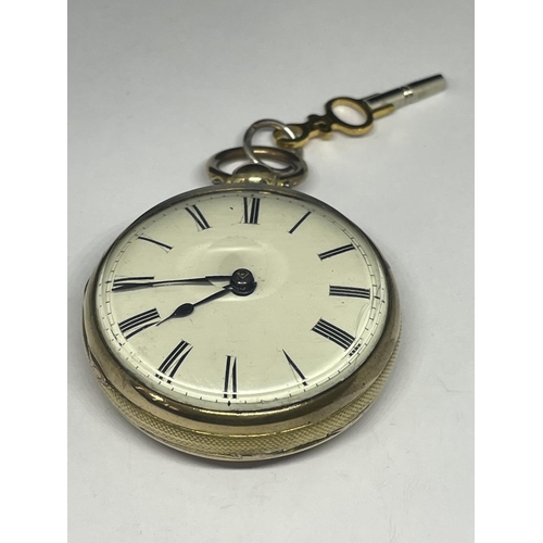 683 - AN EARLY GOLD PLATED POCKET WATCH WITH KEY