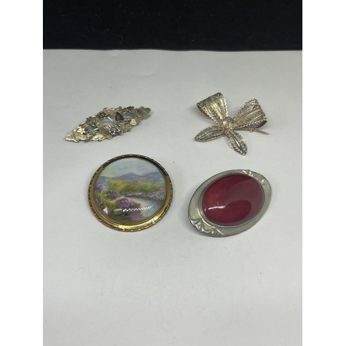 688 - FOUR VARIOUS BROOCHES