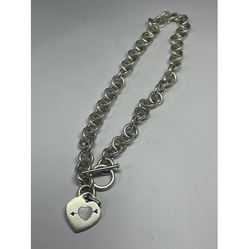 691 - A SILVER T BAR NECKLACE WITH HEART PENDANT