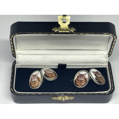 695 - A PAIR OF SILVER CAT CUFFLINKS IN A PRESENTATION BOX